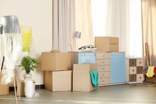 Furniture pick-up team handling bulky items in a Crayford home