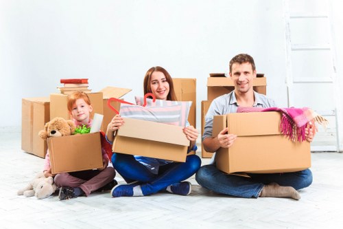 Unpacking and organising boxes after a move in a Crayford home