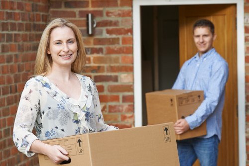Professional movers loading items for a Crayford relocation