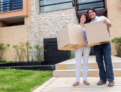 Moving van and removal team handling a home relocation
